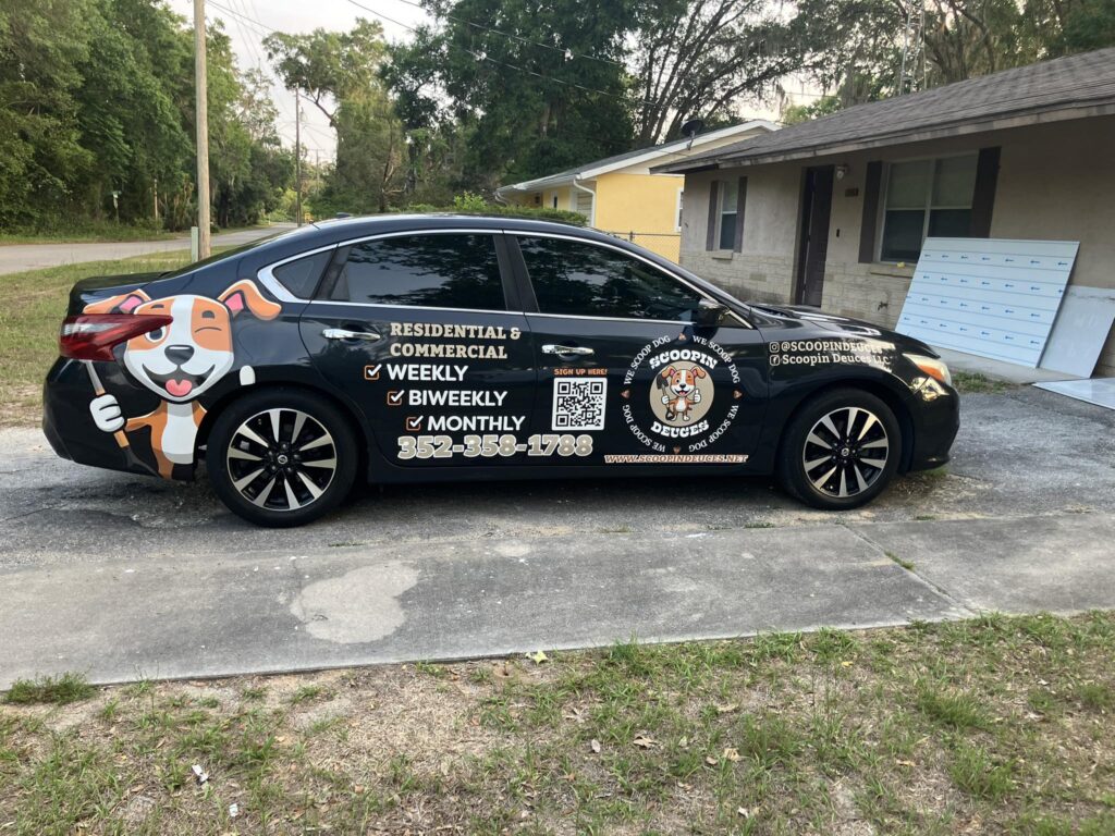 scoopin deuces, a dog poop scooper company in ocala, fl, wrapped vehichle